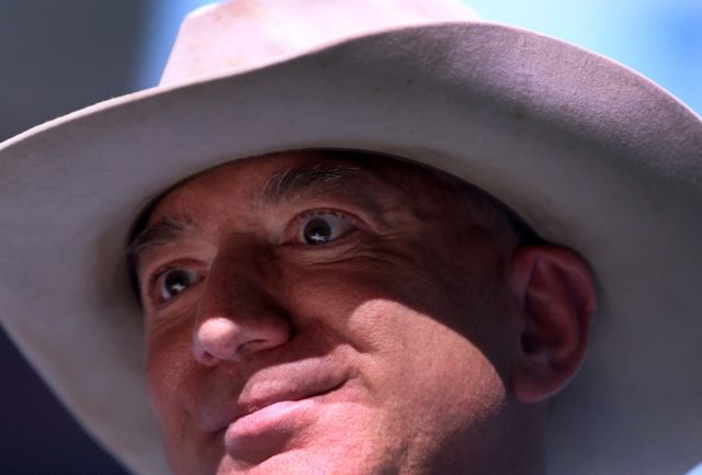 Jeff Bezos speaks about his flight on Blue Origin's New Shepard into space during a press