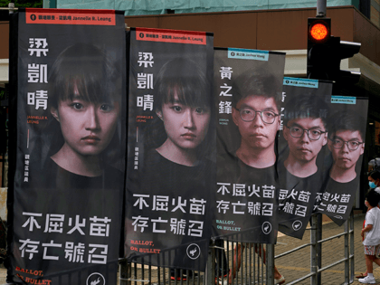 In this July 11, 2020, file photo, banners of a pro-democracy candidate Joshua Wong, weari
