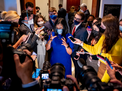 Rep. Pramila Jayapal, D-Wash., speaks to reporters as she walks out of a House Democratic Progressive Caucus meeting on Capitol Hill in Washington, Thursday, Oct. 28, 2021. (AP Photo/Andrew Harnik)