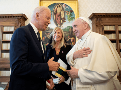 Joe Biden, left, talks to Pope Francis