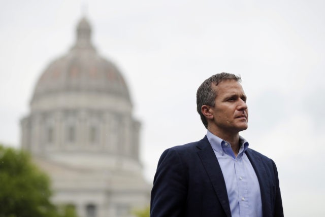 In this May 17, 2018, photo, Missouri Gov. Eric Greitens stands off to the side before stepping up to the podium to deliver remarks to a small group of supporters near the capitol announcing the release of funds for the state's biodiesel program in Jefferson City, Mo. A St. Louis …