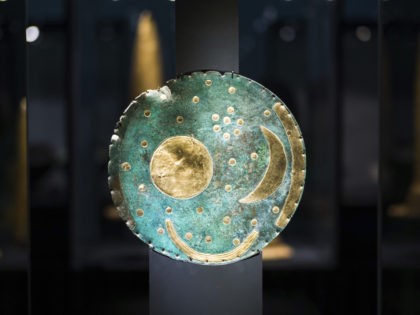 In this Sept. 20, 2018 photo the so-called Sky Disc of Nebra, made of bronze and gold, from 1,600 BC. is displayed at an archeological exhibition at the Martin-Gropius-Bau museum in Berlin. The new exhibition showcasing more than 1,000 major archaeological finds from the past 20 years shows reveals how …