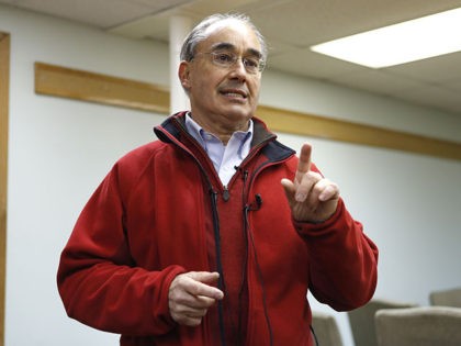 U.S. Rep. Bruce Poliquin, R-Maine, speaks to reporters during a campaign stop Wednesday, Oct. 24, 2018, in Old Town, Maine. Poliquin's re-election effort is being challenged by Democratic State Rep. Jared Golden. (AP Photo/Robert F. Bukaty)