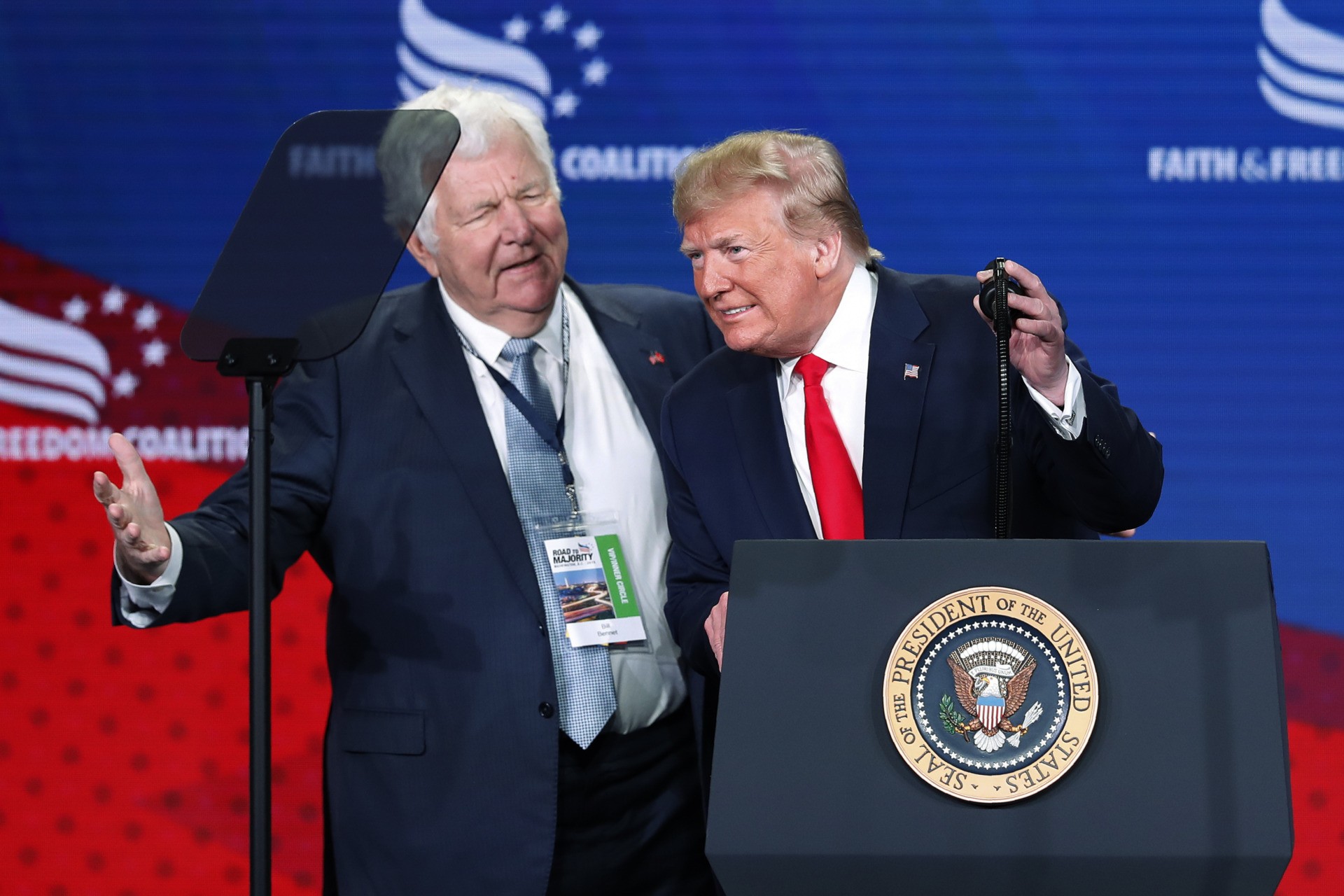 Former Secretary of Education, William J. Bennett, left, joins President Donald Trump on stage to speak at the Faith & Freedom Coalition conference in Washington, Wednesday, June 26, 2019. (AP Photo/Pablo Martinez Monsivais)