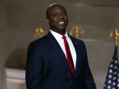 Sen. Tim Scott, R-S.C., smiles as he waits to speak during the first night of the Republican National Convention from the Andrew W. Mellon Auditorium in Washington, Monday, Aug. 24, 2020. (AP Photo/Susan Walsh)