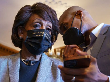 Rep. Maxine Waters, D-Calif., listens to an aide as she joins members of the Congressional Black Caucus to await the verdict in the murder trial of former Minneapolis police Officer Derek Chauvin in the death of George Floyd, on Capitol Hill in Washington, Tuesday, April 20, 2021. (AP Photo/J. Scott …