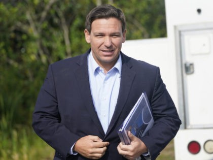 Florida Gov. Ron DeSantis arrives at a news conference, Tuesday, Aug. 3, 2021, near the Sh