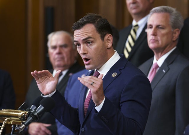 Rep. Mike Gallagher, R-Wis., a former Marine, joins House Minority Leader Kevin McCarthy, R-Calif., right, and other GOP members to criticize President Joe Biden and House Speaker Nancy Pelosi on the close of the war in Afghanistan, at the Capitol in Washington, Tuesday, Aug. 31, 2021. (AP Photo/J. Scott Applewhite)