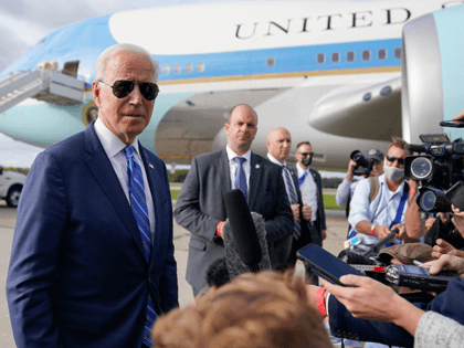 President Joe Biden speaks to members of the media before boarding Air Force One at Capital Region International Airport, Tuesday, Oct. 5, 2021, in Lansing, Mich. (AP Photo/Evan Vucci)