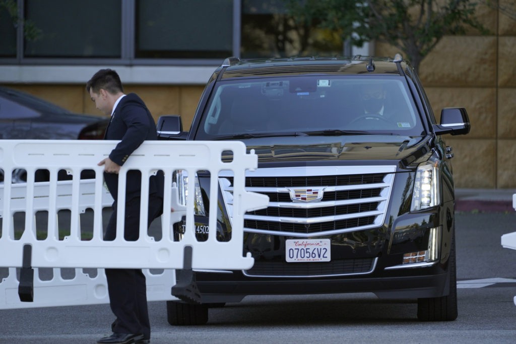 Security agents open a gate blocking the access to vehicles to the University of California Irvine Medical Center in Orange, Calif., Saturday, Oct. 16, 2021. A spokesman says former president Bill Clinton will spend one more night at the hospital where he is recovering from an infection. (AP Photo/Damian Dovarganes)