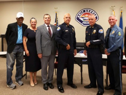 This photo released by the Gulf Shores Police Department shows actor Morgan Freeman, left, with six other members of a panel that interviewed police recruits in Gulf Shores, Ala., on Friday, Oct. 15, 2021. Officials said Freeman, who owns property in the city and spends time there, volunteered to help …