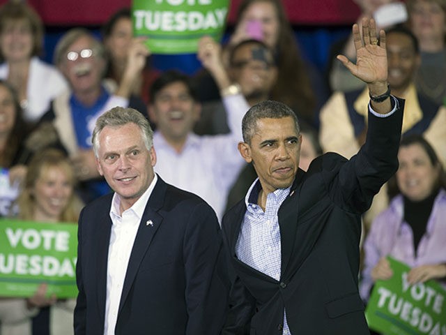 President Barack Obama appears at a campaign rally with supporters for Virginia Democratic gubernatorial candidate Terry McAuliffe, left, at Washington Lee High School in Arlington, Va., Sunday, Nov. 3, 2013. (AP Photo/Cliff Owen)