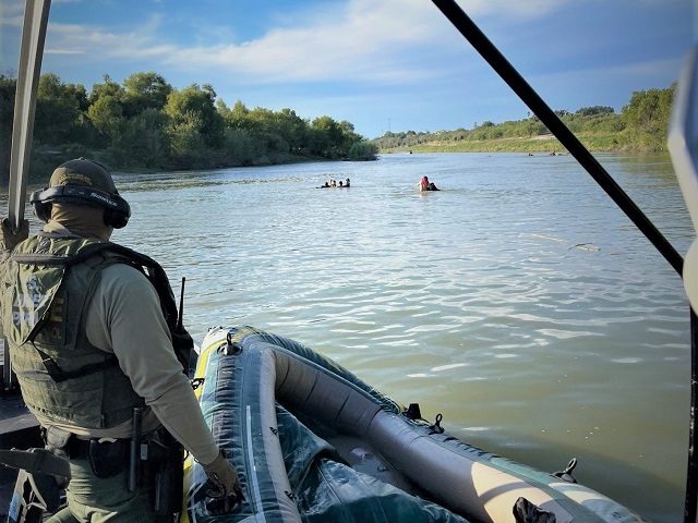 Laredo Border Patrol agents turn back a group of migrants attempting to illegally cross the Rio Grande. (Photo: U.S. Border Patrol/Laredo Sector)