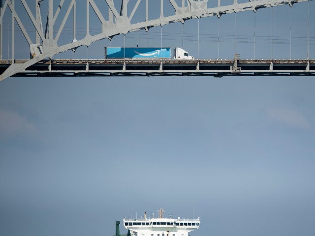 Amazon delivery truck crosses bridge
