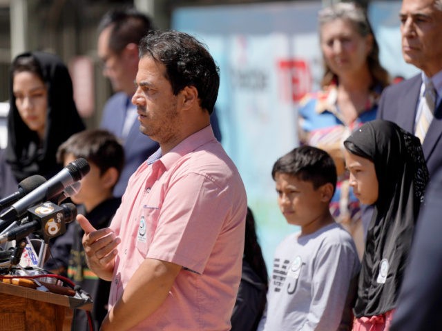 FILE - In this Thursday, Sept. 2, 2021 file photo, Mohammad Faizi, center, speaks during a news conference in El Cajon, Calif. He and his family were visiting relatives in Afghanistan in August, and were forced to escape as the Taliban seized power. Faizi, a green card holder from the …