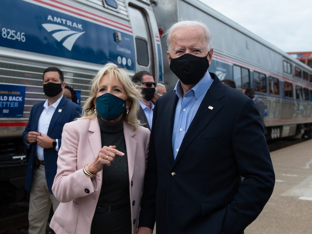 Joe Biden and his wife Jill speak to the press before boarding their train in the Cleveland Train Station on September 30, 2020 in Cleveland, Ohio. (Roberto Schmidt/AFP via Getty Images)