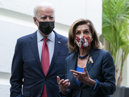 President Joe Biden and House Speaker Nancy Pelosi (D-CA) depart after a House Democratic