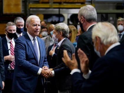 President Joe Biden greets the audience after delivering remarks at the NJ Transit Meadowlands Maintenance Complex to promote his "Build Back Better" agenda, Monday, Oct. 25, 2021, in Kearny, N.J. (AP Photo/Evan Vucci)