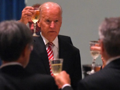 US Vice President Joe Biden gives a toast at a dinner with the Governor of Victoria Linda Dessau (right) at Government House in Melbourne, Sunday, July, 17, 2016. Mr Biden attended the opening of Victorias $1 billion Comprehensive Cancer Centre earlier in the day. (Photo by Tracey Nearmy - Pool/Getty …