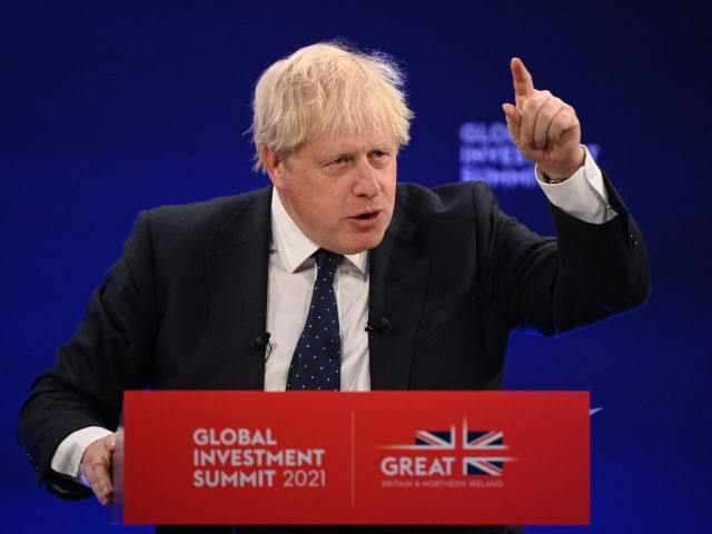 LONDON, ENGLAND - OCTOBER 19: Prime Minister Boris Johnson speaks during the Global Investment Summit at the Science Museum on October 19, 2021 in London, England. The summit brought together British politicians, royalty, CEOs of the world's biggest banks and other business leaders with the aim of highlighting how the …