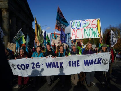 GLASGOW, SCOTLAND - OCTOBER 30: Pilgrimage groups who have walked to Glasgow are joined by members of the group, Extinction Rebellion as they walk to raise awareness of the climate crisis on October 30, 2021 in Glasgow, Scotland. The protest forms part of a series of events to be held …
