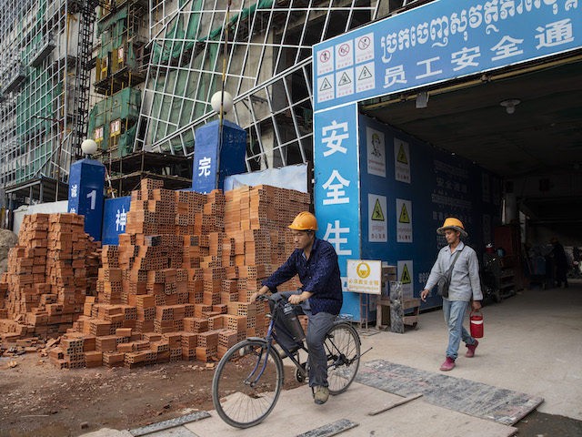 Construction workers head home from The Peak construction project which will be a 55 story