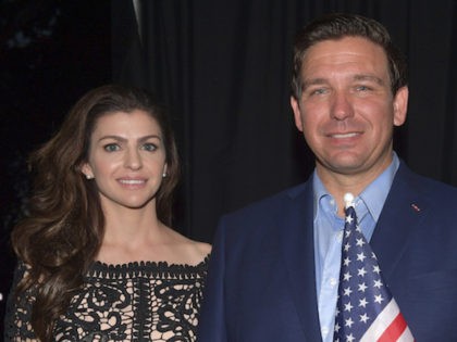 Ron DeSantis, and his wife Casey DeSantis along with Attorney General Pam Bondi pose back stage with the America Flag in Boca Raton on November 4, 2018 in Boca Raton, Florida. (Hoo-Me.com / MediaPunch *** NO NY PAPERS*** /IPX)