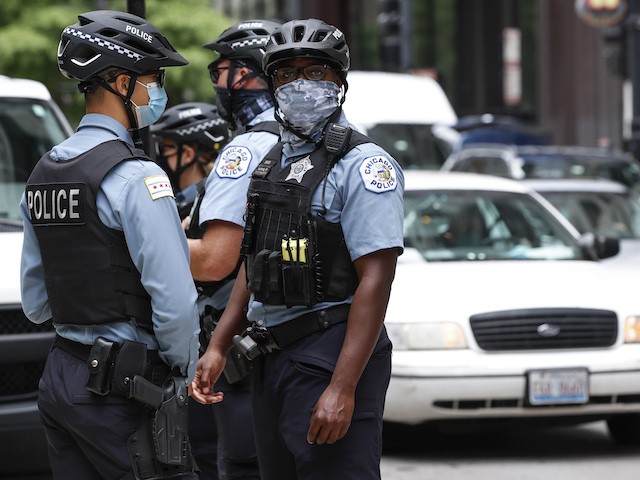 Chicago Police Officers monitor the Occupy City Hall Protest and Car Caravan hosted by Chicago Teachers Union in Chicago, Illinois, on August 3, 2020. (Kamil Krzaczynski/AFP via Getty Images)