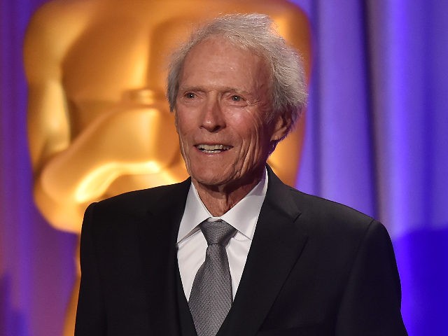 US actor Clint Eastwood introduces Argentinian composer Lalo Schifrin (out of frame) accepting an honorary Oscar at the 10th Annual Governors Awards gala hosted by the Academy of Motion Picture Arts and Sciences at the the Dolby Theater at Hollywood & Highland Center in Hollywood, California on November 18, 2018. …