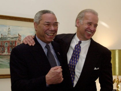 Secretary of State-designate Colin Powell, left, and Sen. Joseph Biden, D-Del., pose for photographers on Capitol Hill Tuesday, Jan. 9, 2001. Powell is holding a series of meetings with senators prior to his confirmation hearing next week. (AP Photo/Dennis Cook)