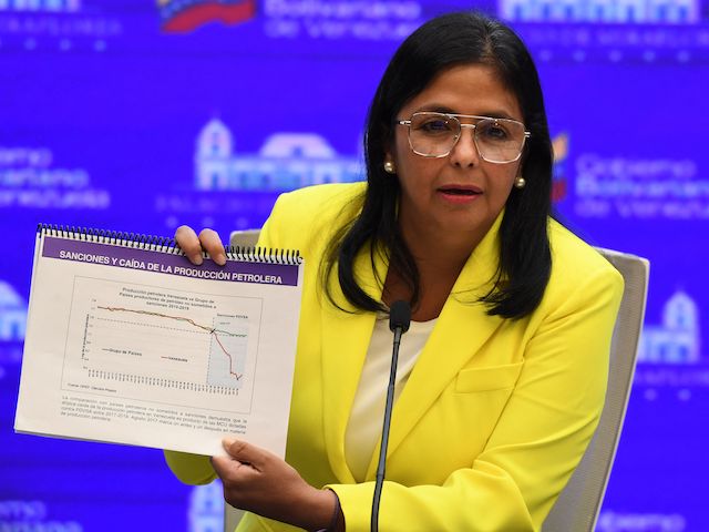 Venezuelan Vice President Delcy Rodriguez shows a graph while speaking during a press conference at the Miraflores Presidential Palace in Caracas, on August 24, 2021. (Federico Parra/AFP via Getty Images)
