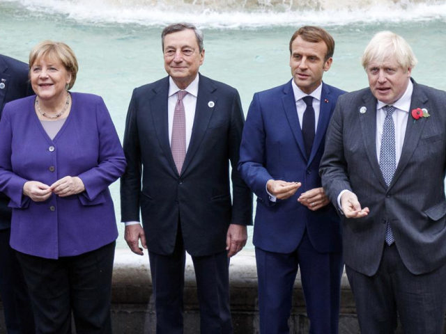 From left, German Chancellor Angela Merkel, Italian Premier Mario Draghi, French President Emmanuel Macron and British Prime Minister Boris Johnson stand at the Trevi Fountain during an event for the G20 summit in Rome, Sunday, Oct. 31, 2021. The two-day Group of 20 summit concludes on Sunday, the first in-person …
