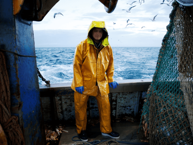 French Fisherman Victor, 21-years-old, works on board the "Nounoute" trawler during its 17-hours fishing trip on July 31, 2018 off the coast of Ouistreham, northwestern France. - This 45-year-old trawler catches Flounder during the night and Mackerel during the day. (Photo by CHARLY TRIBALLEAU / AFP) (Photo credit should read …