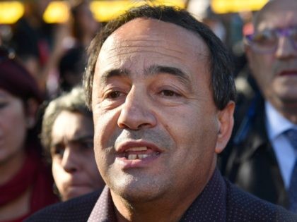 Riace mayor, Domenico Lucano takes part in a march of people, including employees of the country's social and reception centers and members of anti-racism associations, against the government's social politics, its recent decree restricting the right to asylum, and against racism on November 10, 2018 in downtown Rome. (Photo by …