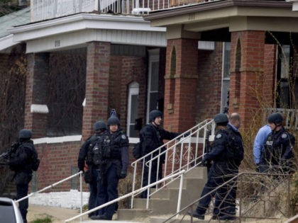 ST. LOUIS, MO - MARCH 8: Law enforcement officials surround a house at the scene where two