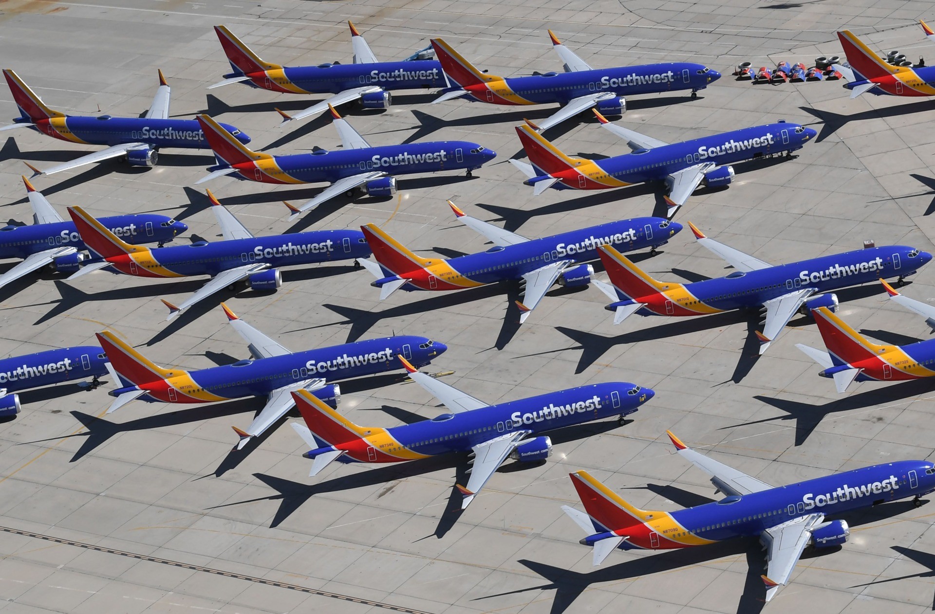 TOPSHOT - Southwest Airlines Boeing 737 MAX aircraft are parked on the tarmac after being grounded, at the Southern California Logistics Airport in Victorville, California on March 28, 2019. - After two fatal crashes in five months, Boeing is trying hard -- very hard -- to present itself as unfazed by the crisis that surrounds the company. The company's sprawling factory in Renton, Washington is a hive of activity on this sunny Wednesday, March 28, 2019, during a tightly-managed media tour as Boeing tries to communicate confidence that it has nothing to hide. Boeing gathered hundreds of pilots and reporters to unveil the changes to the MCAS stall prevention system, which has been implicated in the crashes in Ethiopia and Indonesia, as part of a charm offensive to restore the company's reputation. (Photo by Mark RALSTON / AFP) (Photo credit should read MARK RALSTON/AFP via Getty Images)