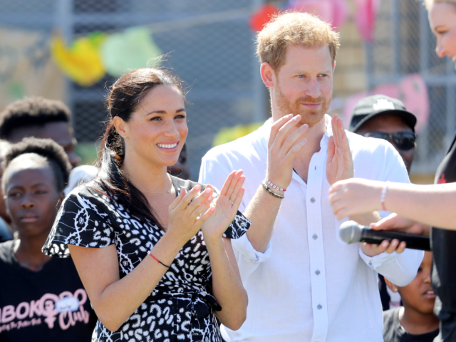 CAPE TOWN, SOUTH AFRICA - SEPTEMBER 23: Meghan, Duchess of Sussex and Prince Harry, Duke of Sussex smile as they visit a Justice Desk initiative in Nyanga township, during their royal tour of South Africa on September 23, 2019 in Cape Town, South Africa. The Justice Desk initiative teaches children …