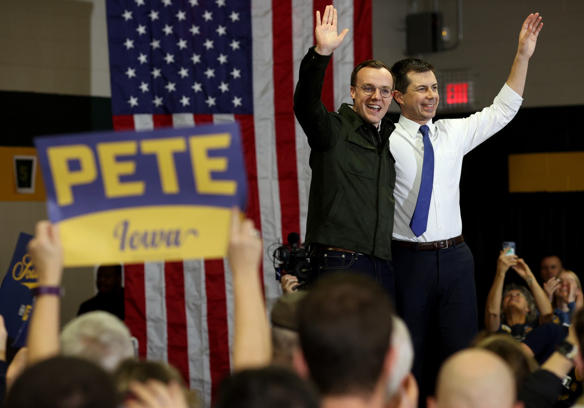 CORALVILLE, IOWA - FEBRUARY 02: Democratic presidential candidate former South Bend, Indiana Mayor Pete Buttigieg (R) and his husband Chasten (L) wave to supporters after the candidate spoke at Northwest Junior High School during a Get Out The Caucus rally February 2, 2020 in Coralville, Iowa. Iowa holds the state's caucuses tomorrow, the first test for prospective presidential candidates in the 2020 election. (Photo by Win McNamee/Getty Images)