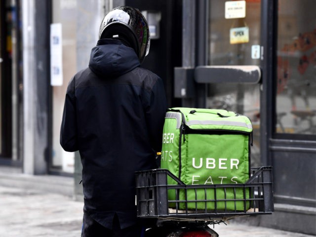 Illustration picture shows An Uber Eats courier in Brussels, Friday 13 March 2020. Federal government announced Yesterday new measures to stop the spreading of Covid-19. Restaurants and cafes will be closed, school lessons are suspended from Monday. Sports and recreational events are cancelled. BELGA PHOTO DIRK WAEM (Photo by DIRK …