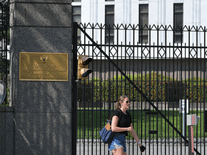 A pedestrian is seen in front of the Embassy of Russia in Washington, DC on April 15, 2021. - The US announced sanctions against Russia on April 15, 2021, and the expulsion of 10 diplomats in retaliation for what Washington says is the Kremlin's US election interference, a massive cyber …