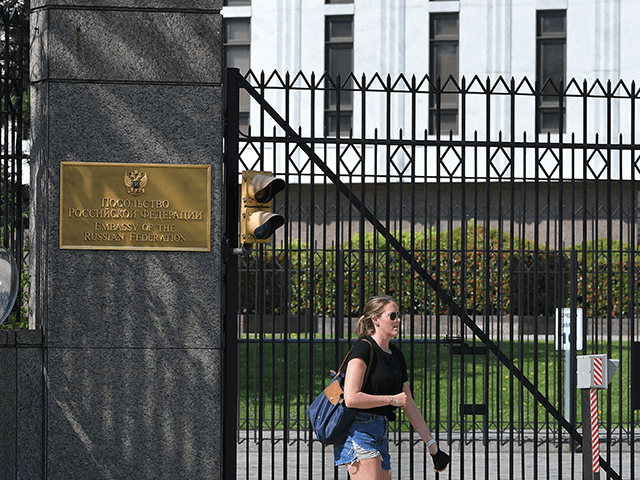 A pedestrian is seen in front of the Embassy of Russia in Washington, DC on April 15, 2021