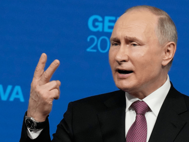 Russia's President Vladimir Putin holds a press conference after meeting with US President