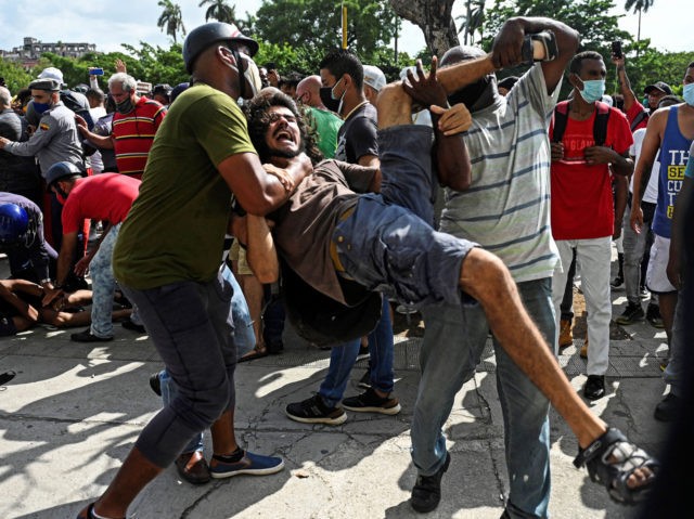 A man is arrested during a demonstration against the government of Cuban President Miguel