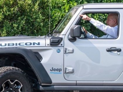 US President Joe Biden drives a Jeep Wrangler Rubicon 4xe after delivering remarks on the