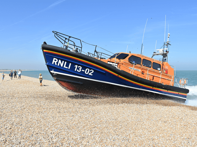 RNLI (Royal National Lifeboat Institution) Shannon class life boat 'The Morrell' drives up onto the beach in Lydd on Sea, near to where migrants have been arriving, in southeast England on September 8, 2021. (Photo by JUSTIN TALLIS / AFP) (Photo by JUSTIN TALLIS/AFP via Getty Images)