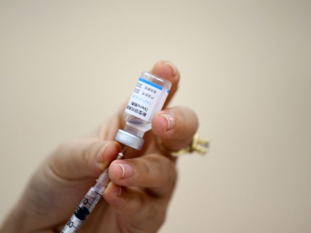 A nurse prepares a dose of the Sinopharm Covid-19 coronavirus vaccine in Hanoi on Septembe