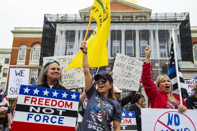 Demonstrators gathered outside the Massachusetts State House in Boston to protest Covid-19 vaccination and mask mandates. (Photo by JOSEPH PREZIOSO / AFP) (Photo by JOSEPH PREZIOSO/AFP via Getty Images)