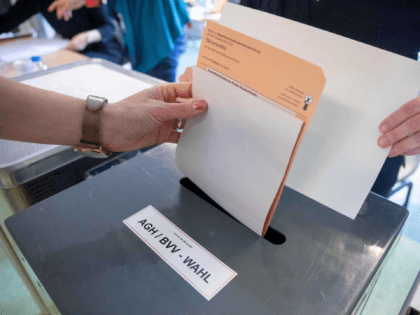 A voter casts a ballot on the election of the Berlin House of Representatives (Abgeordnetenhaus, AGH) and the Pankow district parliament (Bezirksverodnetenversammlung, BVV), at a polling station in Berlin on September 26, 2021, during Berlin State and German federal elections. (Photo by JAN ZAPPNER / AFP) (Photo by JAN ZAPPNER/AFP …