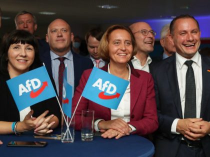 Deputy leader of the parliamentary group of the far-right Alternative for Germany (AfD) party Beatrix von Storch (C) and co-leader and top candidate of Germany's far-right Alternative for Germany (AfD) party Tino Chrupalla (R) react after the exit polls were broadcast on television at the event location "La Festa" in …