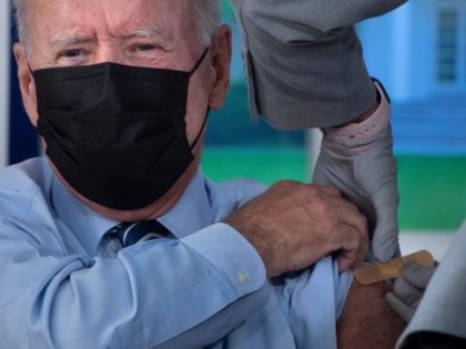 US President Joe Biden has a band-aid applied after a third shot of the Pfizer Covid-19 vaccine as a booster on the White House campus September 27, 2021, in Washington, DC. - Joe Biden faces the most important test of his presidency this week as Democrats in the US Congress …